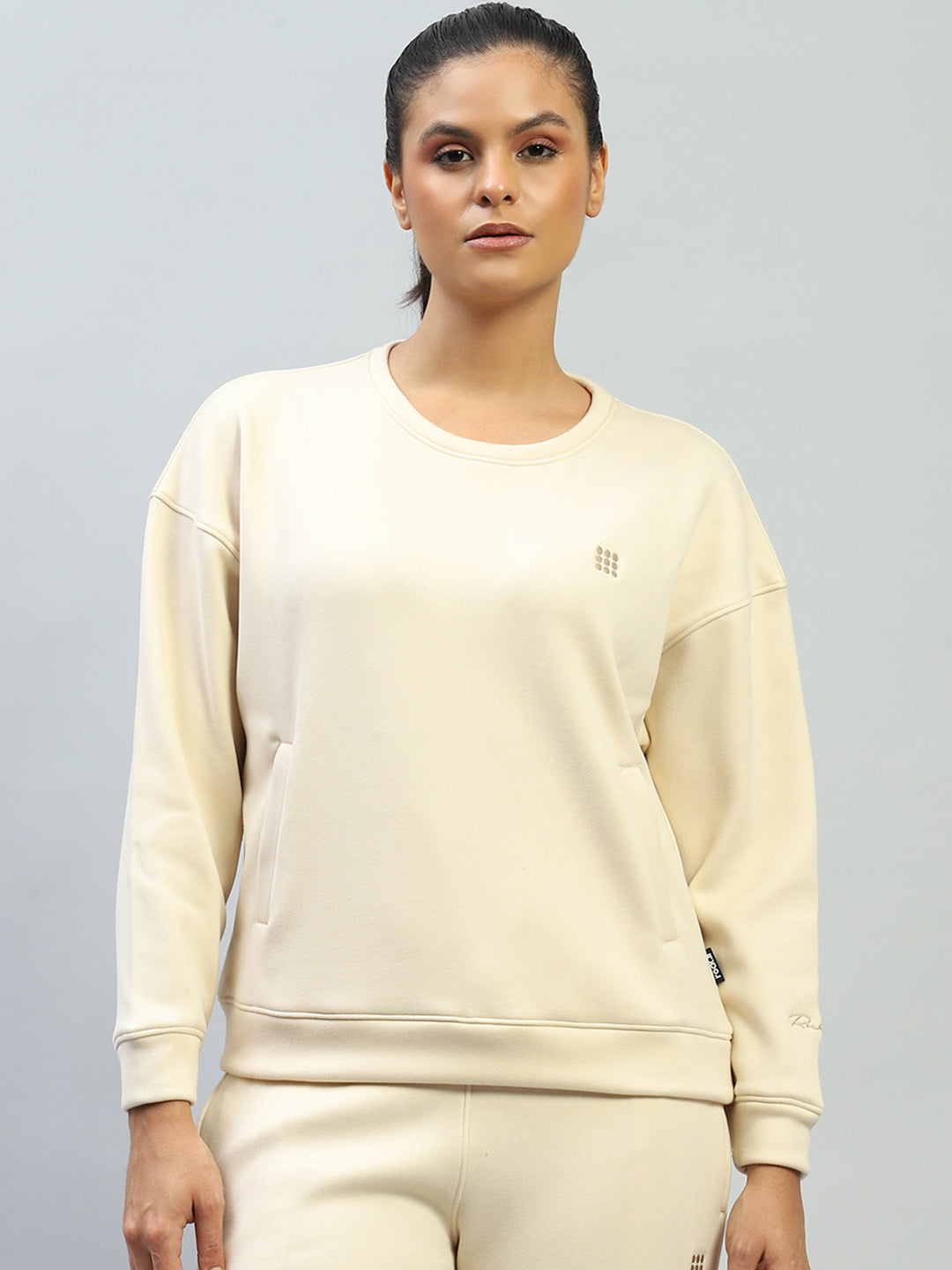Women Cream Solid Round Neck Full Sleeve Sweatshirt