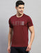 Men Maroon Self Design Round Neck Half Sleeve T-Shirt