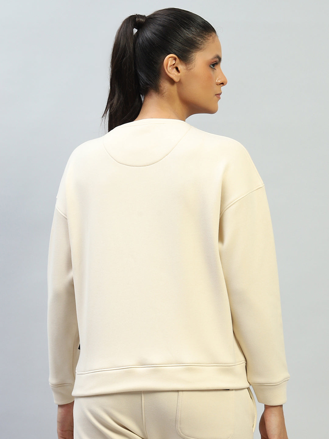 Women Cream Solid Round Neck Full Sleeve Sweatshirt