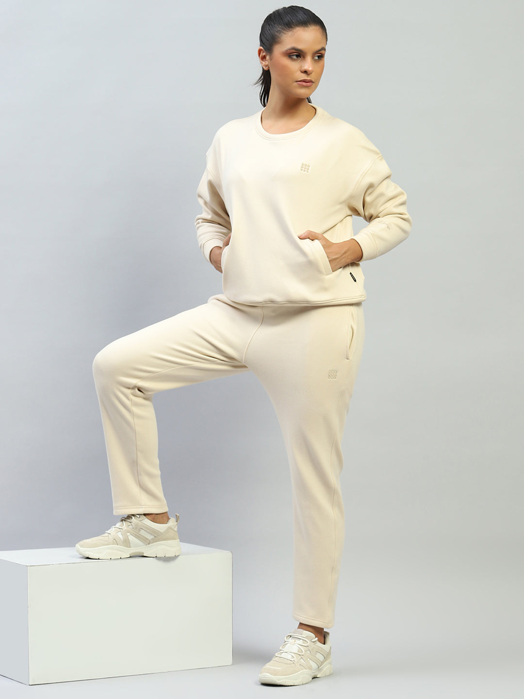 Women Cream Solid Round Neck Full Sleeve Sweatshirt